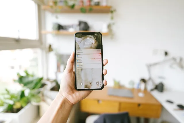 iphone, hand, phone, mobile phone, smart phone, technology, hand holding a phone, notify, notifications, updates, messages, iphone, iphone, phone, phone, phone, phone, phone, mobile phone, smart phone, smart phone, notifications. Digital boundaries checklist for work, home, privacy, and safety