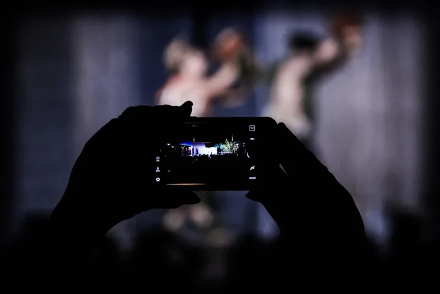 500px provided description: You Re A Passive Observer And It Is All Moving [#concert ,#phone ,#iphone ,#frame ,#event ,#screen ,#out of touch ,#life passing by ,#screen time ,#watching through iphone ,#experience the world through a screen]. Digital wellbeing problems: when simple screen-time rules fail