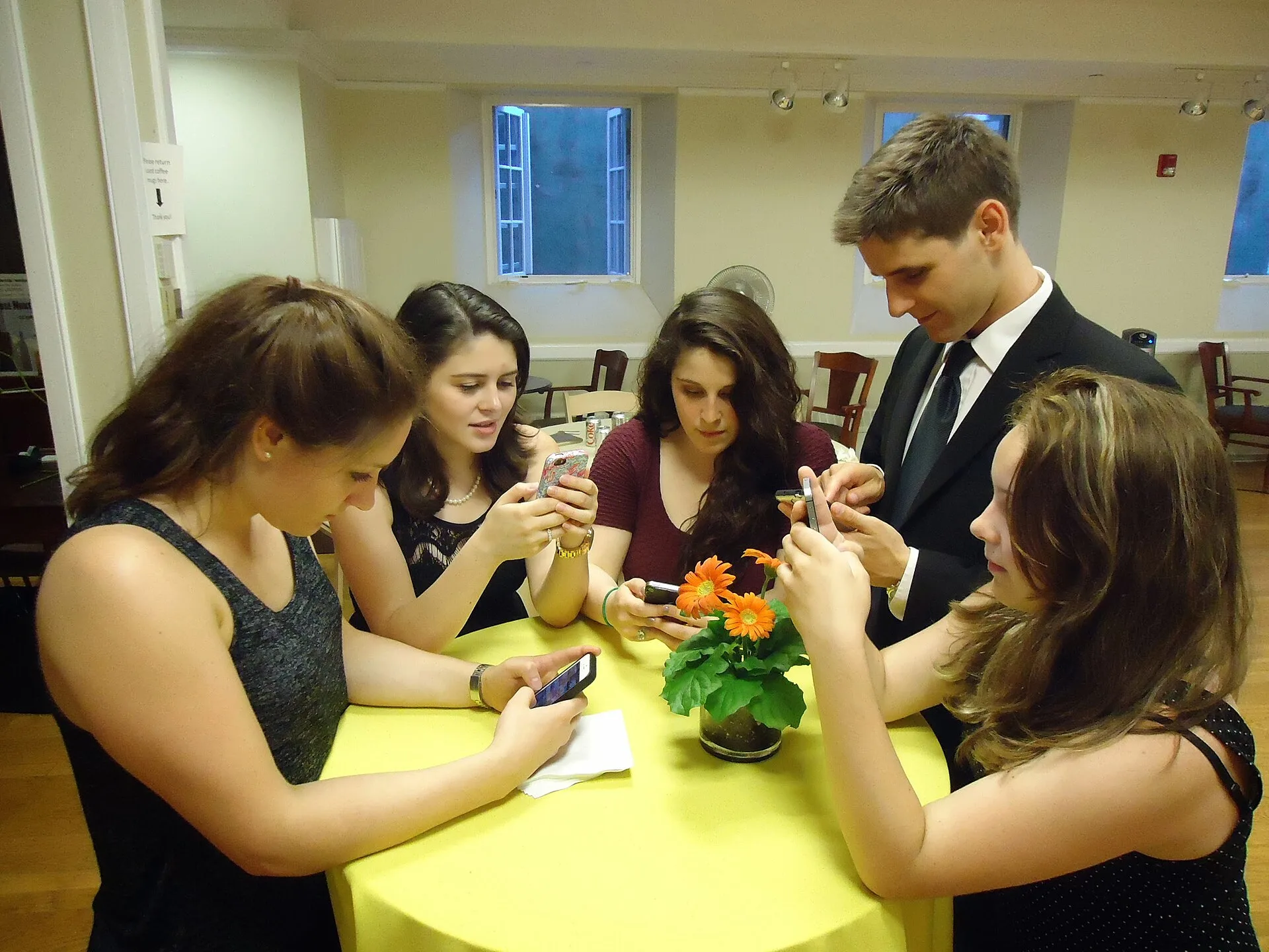 Young people using their smartphones at a party. The ever-present use of smartphones for multiple purposes has led some writers to describe young people as the "thumb tribe" or "thumb generation". How to reset a scrolling habit without abandoning your phone